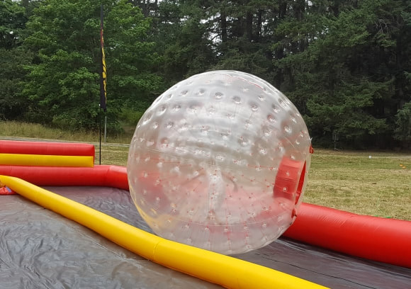 blow up ball sitting in a hamster ball race course